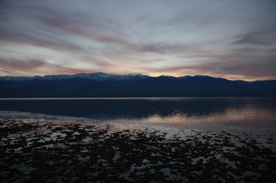 The sunset reflecting on the lake at Badwater, California, with the Panamint range in the background.