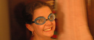 Renata donning swimming goggles.
