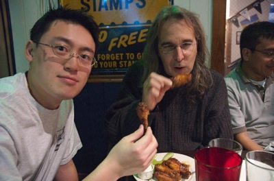 Taowei and Chris eating wings